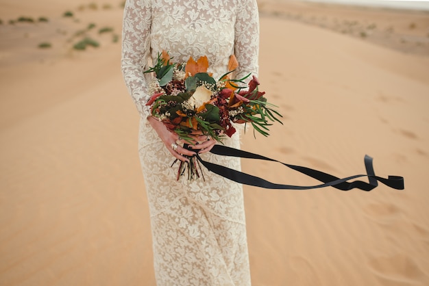 Premium Photo Close Up Of A Caucasian Bride Hands Holding A Beautiful Flower Bouquet