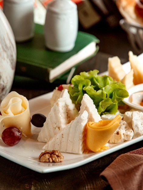 Free Photo | Close up of cheese plate with cheddar white cheese goat ...