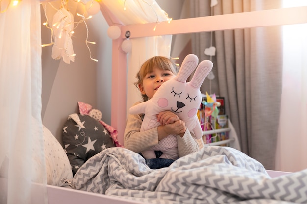 Free Photo | Close up on child playing in her room