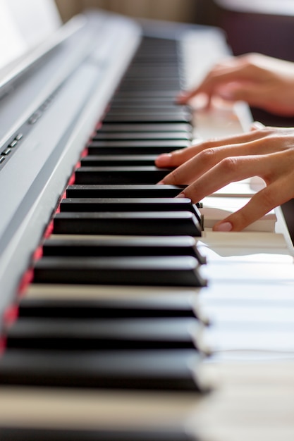 Premium Photo | Close-up of a classic music performer's hand playing ...