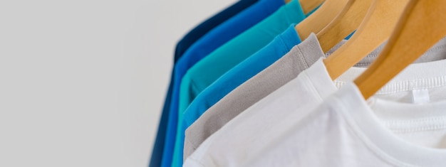 Premium Photo Close Up Of Colorful T Shirts On Hangers Apparel Background