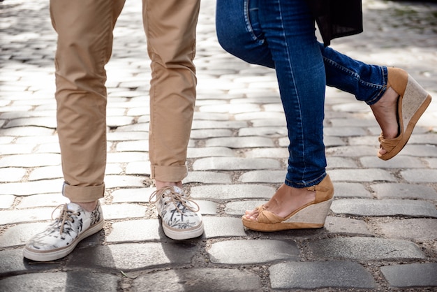 legs in keds standing at street 