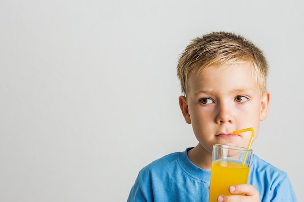 Closeup Cute Kid Drinking Juice Photo Free Download