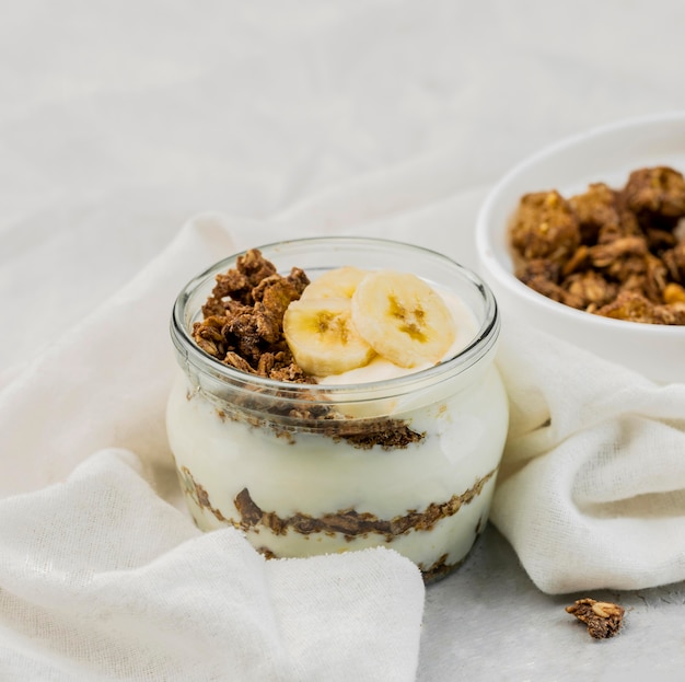 Free Photo | Close-up delicious yogurt with granola and banana