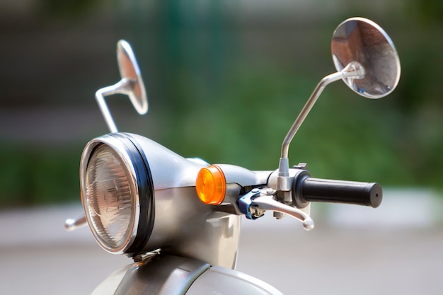 Premium Photo | Close-up detail of new white shiny motorbike with round ...