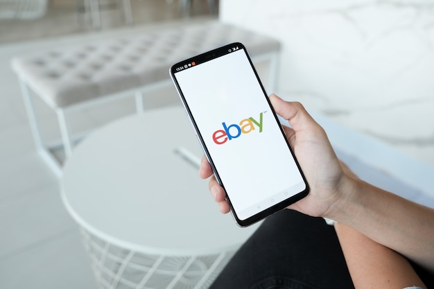 Close up of ebay app on a apple smartphone screen. ebay is one of the largest online auction and shopping websites Premium Photo