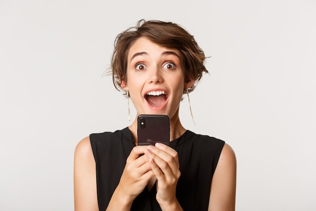 Premium Photo Close Up Of Excited Attractive Woman Gasping Amazed