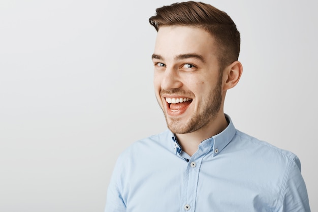 Free Photo | Close-up of excited happy man hear great news, smiling upbeat