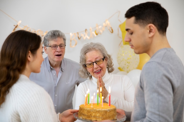 Free Photo | Close up family holding birthday cake