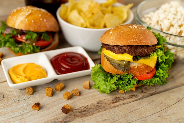 Close-up fast food on wooden background Photo | Free Download