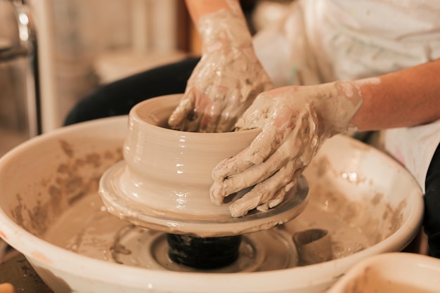 Free Photo Close Up Of Female Potter S Hand Molding With The Clay On Pottery Wheel We hope you enjoy our growing collection of hd images to use as a. hand molding with the clay on pottery wheel