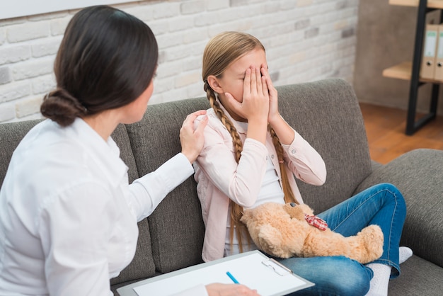 Close Up Of A Female Psychologist Giving Support To The Crying