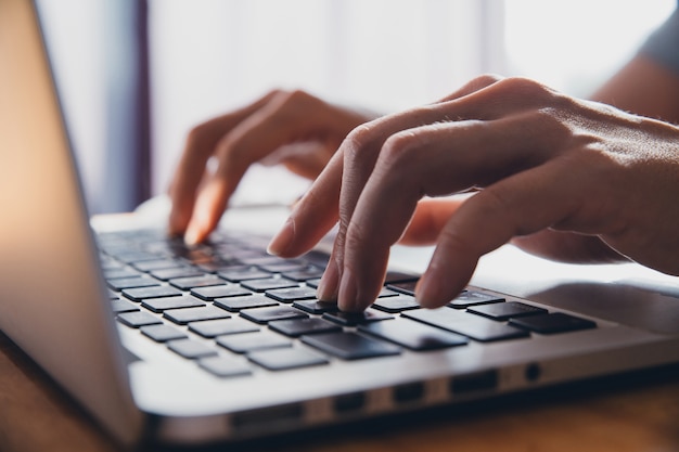 Premium Photo | Close up fingers typing on the computer keyboard ...