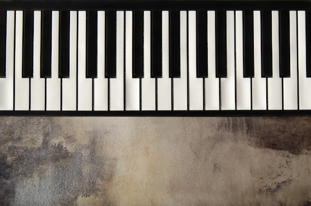 Premium Photo | Close-up of flat piano keyboard, top view. piano keys