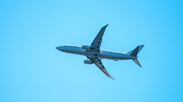 Free Photo | Close up on flying plane in the clear sky