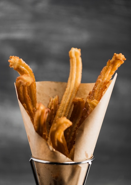 Free Photo Close Up Fried Churros In A Wrapping Paper Free Photo Close Up Fried Churros In A Wrapping Paper