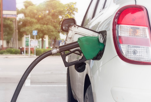 Close up of fuel monitoring system refueling a petroleum to vehicle at gas station Premium Photo