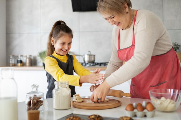 Free Photo | Close up on girl cooking with her grandmother