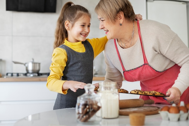 Free Photo | Close up on girl cooking with her grandmother