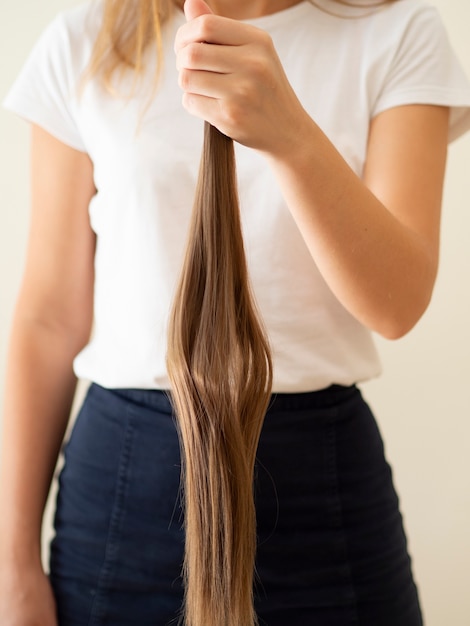 Free Photo | Close-up girl holding up brown hair