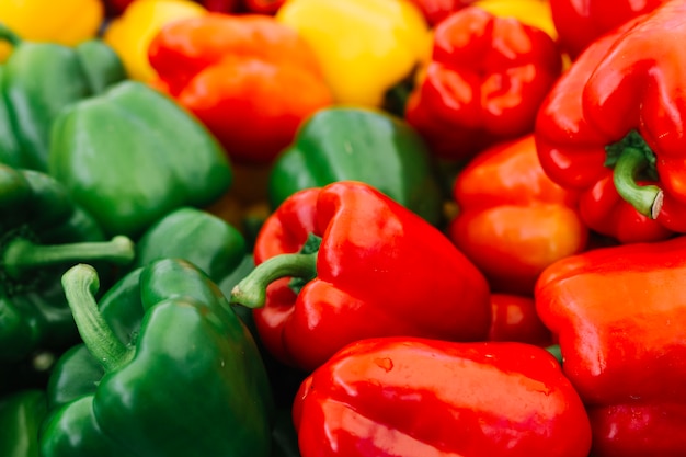 Close-up of green and red bell pepper Free Photo