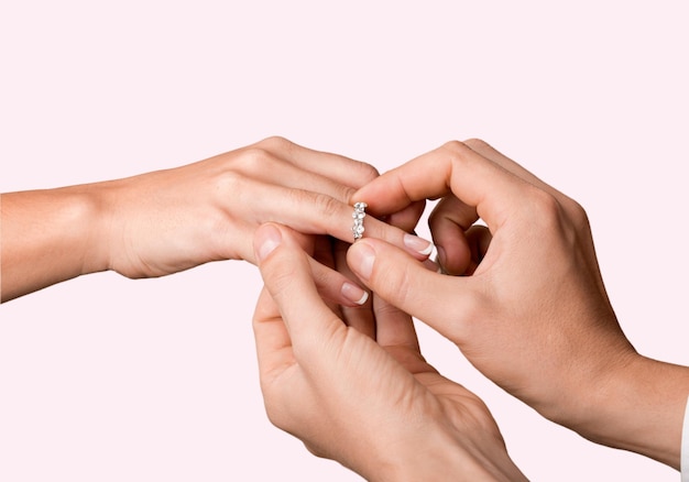 Premium Photo Close Up Groom Putting The Wedding Ring On Bride S Finger