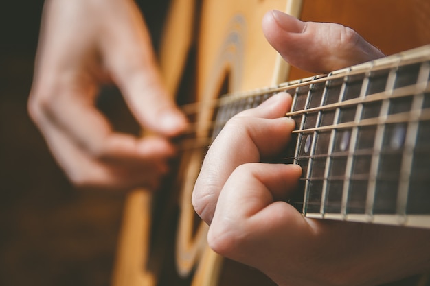 Premium Photo Close Up Of Guitarist Hand Playing Guitar