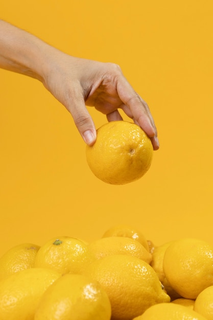 Free Photo | Close-up hand holding fresh lemon
