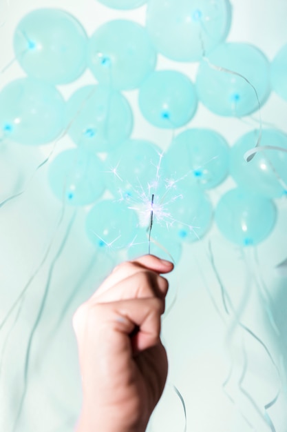 Close Up Of Hand Holding Sparkler Under The Decorative Ceiling