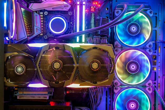 Premium Photo | Close-up and inside desktop pc gaming and cooling fan cpu  with multicolored led rgb light show status on working mode, interior pc  case technology background