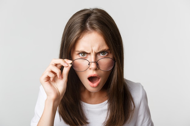 Premium Photo | Close-up of insulted and shocked young angry woman ...