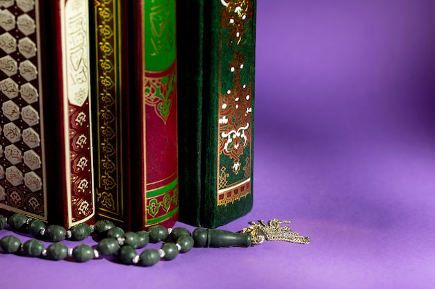 Premium Photo | Close up of islamic books and prayer beads