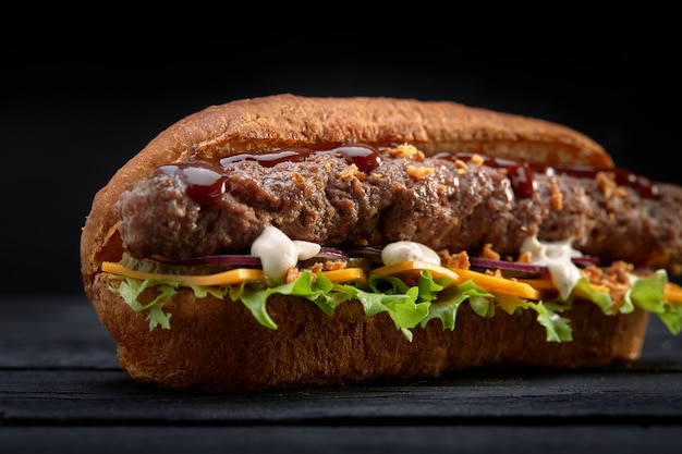 Premium Photo Close Up Of Kebab Sandwich On Black Wooden Background