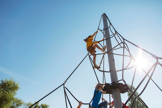 Premium Photo | Close up kids climbing rope