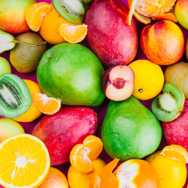 Free Photo | Close-up of kiwi; mango; pear; orange and apricot fruits