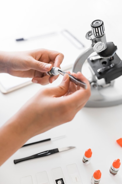 free-photo-close-up-of-lab-technician-doing-experiment-in-lab