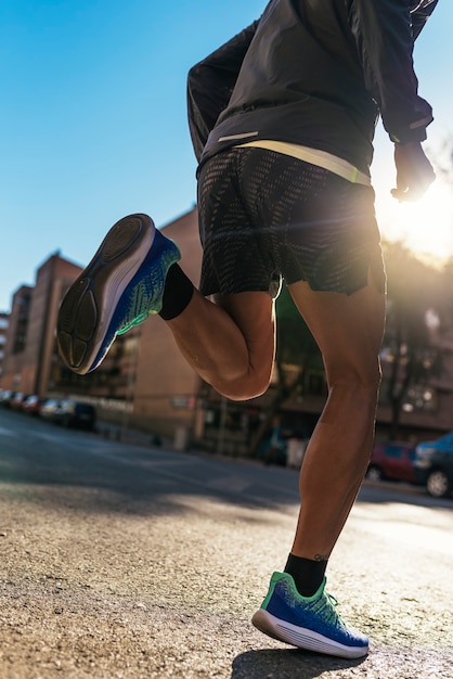 Premium Photo | Close up of legs of runner in the city. fitness ...
