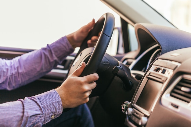 Premium Photo | Close-up of a male hand in a modern car