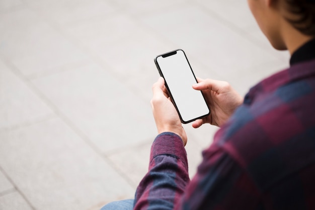 Premium Photo | Close-up man holding phone with mock-up