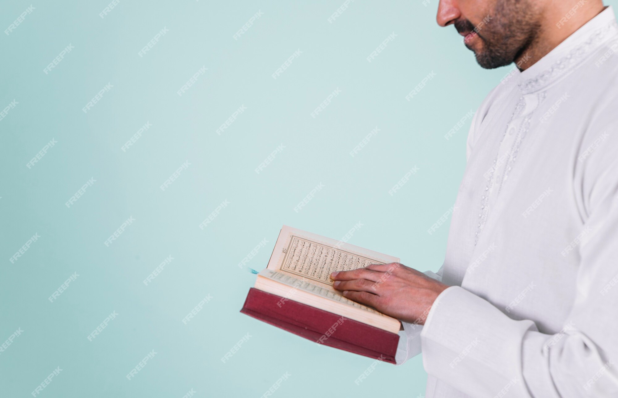 Premium Photo | Close up of man reading in quran