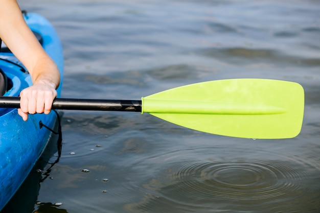 Free Photo | Close-up of a man's hand paddling a kayak