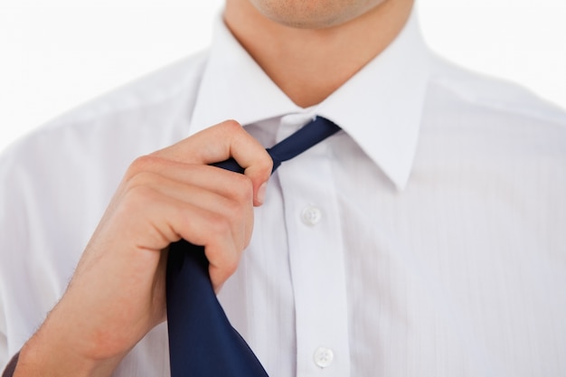 Premium Photo | Close-up of a man undoing his tie