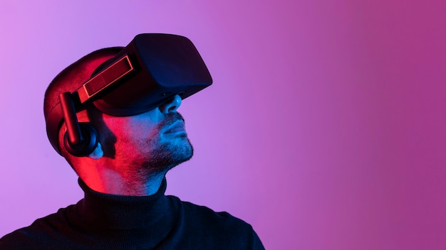 Free Photo | Close-up man wearing vr glasses