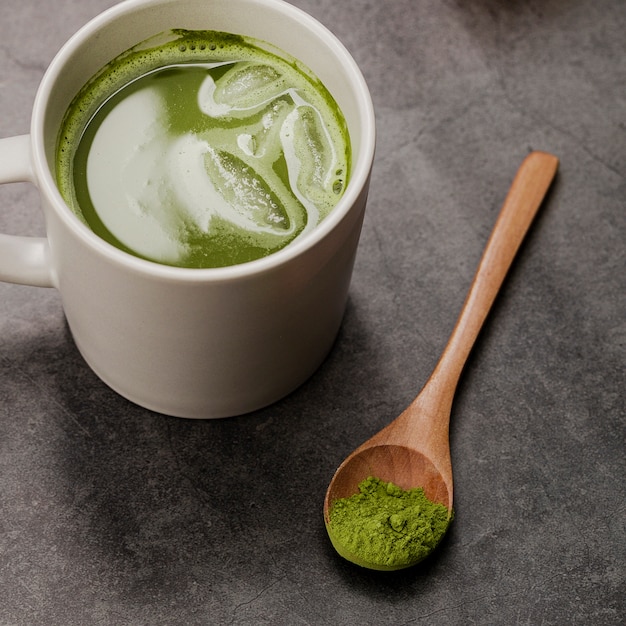 Premium Photo | Close-up of matcha tea in cup with spoon