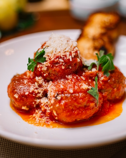 Free Photo Close Up Of Meatballs Plate Garnished With Tomato Sauce