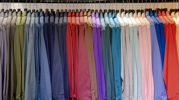 Premium Photo | Close up of multi colored shirts on hangers