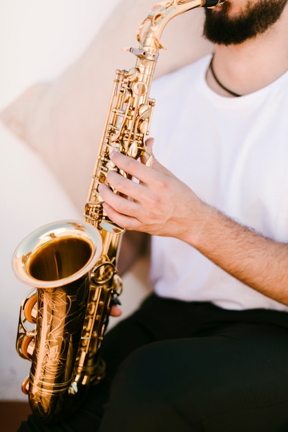 Free Photo | Close up musician playing saxophone