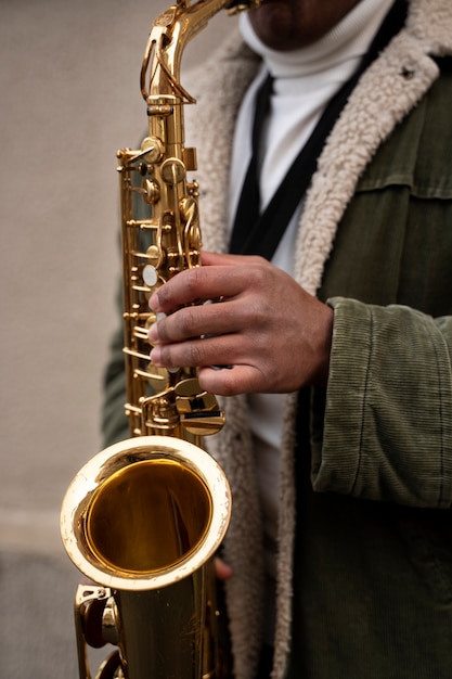 Free Photo | Close up musician playing the saxophone