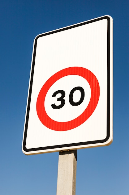 Free Photo Close Up Of Number 30 Traffic Limit Sign Against Blue Sky