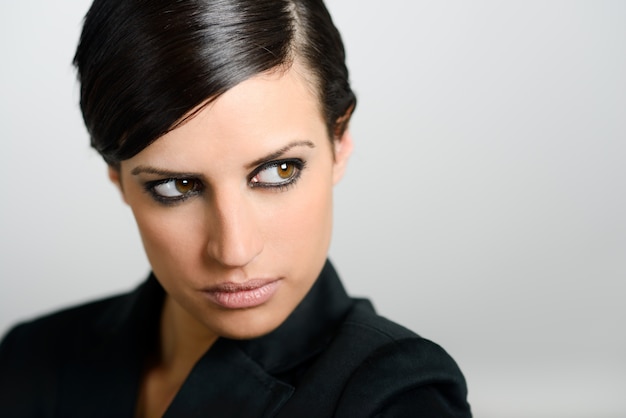 Close-up of brunette woman with intense look Photo | Free Download